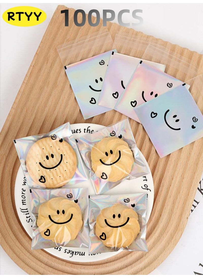 RTYY 100 كيس لاصق ذاتي للبسكويت، أكياس سيلوفان قابلة لإعادة الإغلاق، أكياس بلاستيكية مزينة بتعبيرات لطيفة لخبز البسكويت والحلوى، أكياس بلاستيكية شفافة للحلويات، أكياس تغليف فردية للحلوى، أكياس سيلوفان لتوزيعات الحفلات، لتغليف البسكويت والشوكولاتة والوجبات الخفيفة والمخبوزات (10 × 10 سم). - Image 1